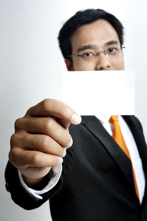 Businessman showing a blank cardの写真素材
