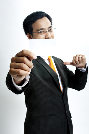 Businessman showing a blank cardの写真素材