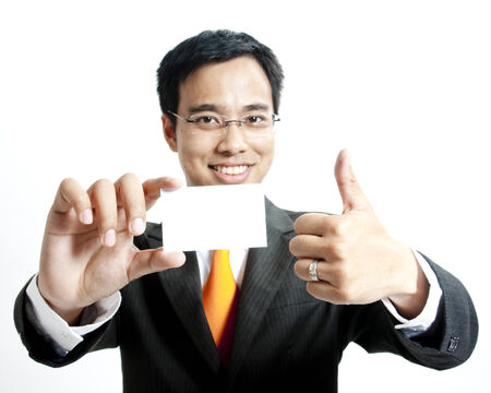Businessman showing a blank cardの写真素材