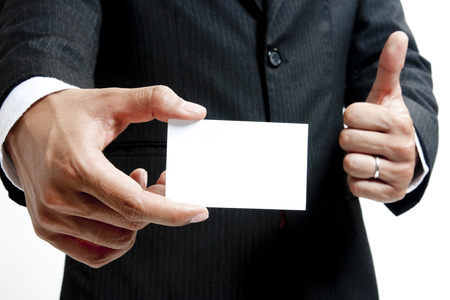 Businessman showing a blank cardの写真素材
