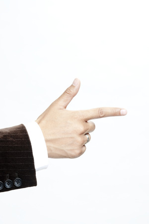 Businessman making a gun signの写真素材