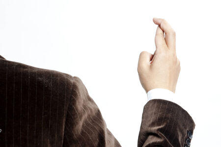 Businessman with fingers crossedの写真素材