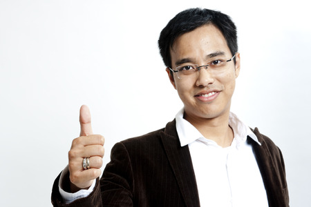 Businessman with thumbs upの写真素材