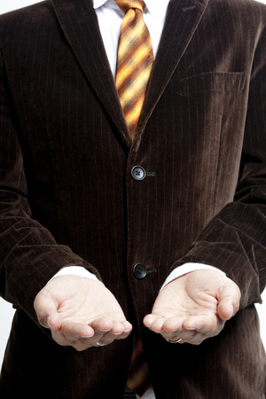 Businessman with two palms openの写真素材