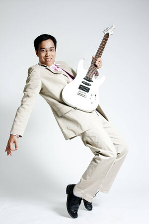Businessman with an electric guitarの写真素材
