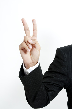 Businessman showing the number 2の写真素材