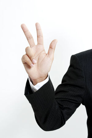 Businessman showing the number 3の写真素材