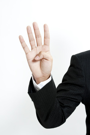 Businessman showing the number 4の写真素材