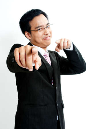 Businessman pointing at cameraの写真素材