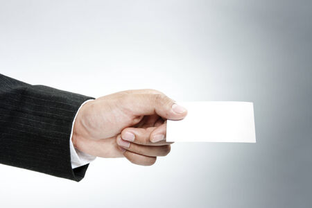 Businessman holding blank cardの写真素材