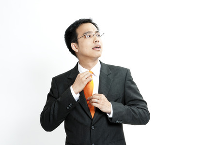 Businessman adjusting his tieの写真素材