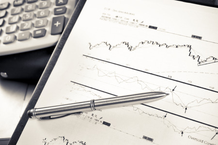 Financial charts and graphs on the tableの写真素材