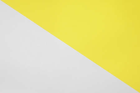 Two color paper with Yellow and white Overlap on the floor And split half of the image. backgroundの写真素材