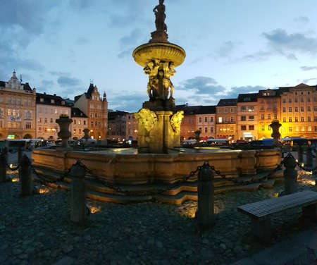 Old square in Ceske Budejovice with brightly lightened tenements aroundの写真素材