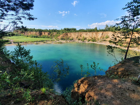 Emerald waters of the "Wydra" reservoir in the GrÃ³dek Parkの写真素材