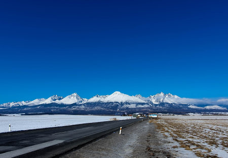 Beautiful landscape of snow mountain and road in winter season