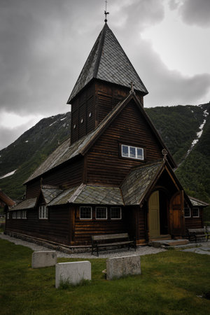 Wooden church in the mountains on a cloudy day, Norway.の写真素材