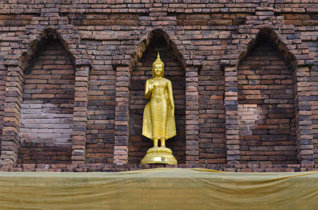 Golden Buddha Model on The Wallの写真素材