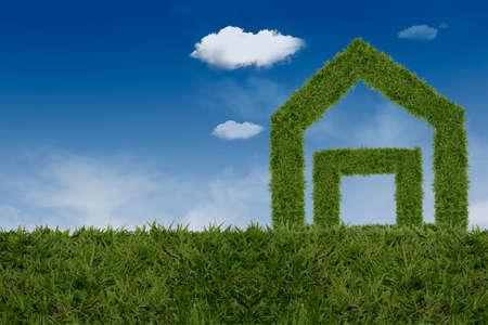 Grass home on a background of blue sky,Beautiful, fluffy, white and grey clouds and blue skyの写真素材