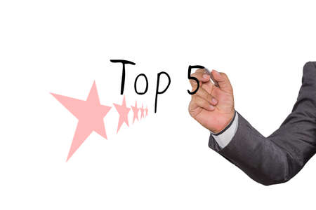 Businessman writing Top 5 with pen on visual screen. Business, technology, internet concept.