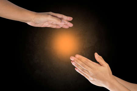 Hands holding  on grey backgroundの写真素材