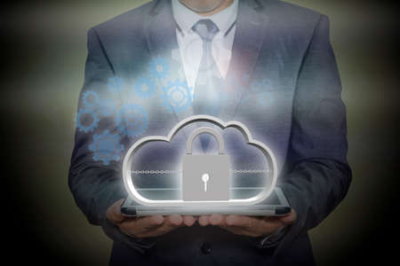 Businessman holding a tablet with internet security concept. information security. data security.の写真素材
