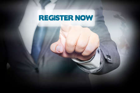 Businessman pressing Register Now on virtual screen. business concept.の写真素材