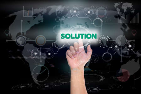 Businessman pressing button on touch screen interface and select SOLUTION. Business concept