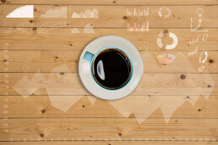 Coffee cup with graph on wooden table,Creative thinking drawing business success strategy plan ideas on wooden table background,の写真素材