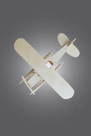 Toy wooden airplane on wooden table