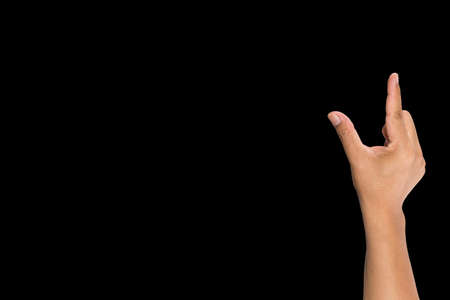 Hand of man to hold card, mobile phone, tablet PC or other isolated on black backgroundの写真素材