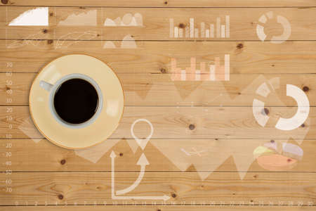 Coffee cup with graph on wooden table,Creative thinking drawing business success strategy plan ideas on wooden table background,の写真素材