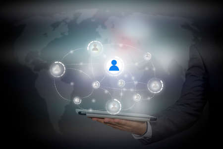 businessman holding a tablet PC with contact on virtual screens - business, technology, internet and...