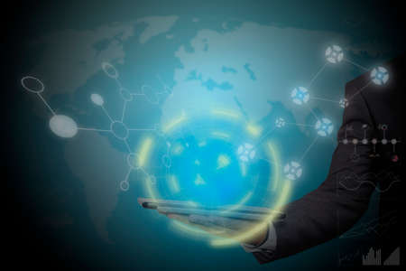 Businessman hand working with modern technology digital tablet computer and digital layer effect as business strategy conceptの写真素材