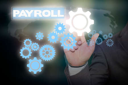 Businessman hand touching  PAYROLL tab on virtual screen , business concept , business ideaの写真素材