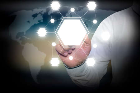 Businessman hand touching  blank icons on virtual screen with  icons linked as networkの写真素材