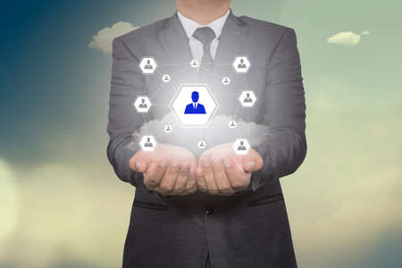Hand carrying businessman icon network - HR,HRM,MLM, teamwork & leadership conceptの写真素材