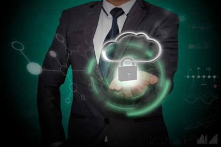 Businessman holding icon with protect cloud information data concept. Security and safety of cloud...
