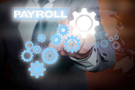 Businessman hand touching  PAYROLL tab on virtual screen , business concept , business ideaの写真素材