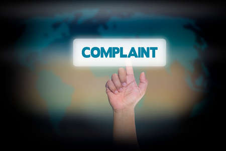 Hand pressing Complaint on virtual screen. business concept.の写真素材
