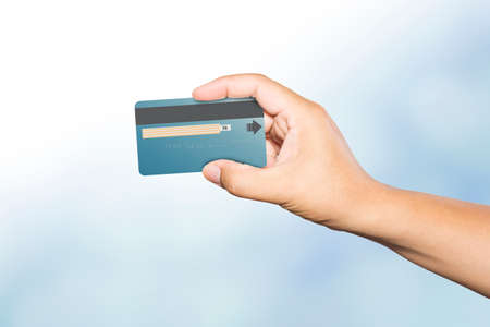 Hand holding credit card , business idea conceptのeditorial素材
