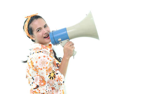 woman talking in megaphone with white wall background, Shouting.のeditorial素材