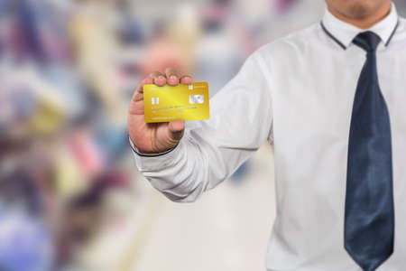 Hand holding credit card, business man showing business card , business idea conceptのeditorial素材