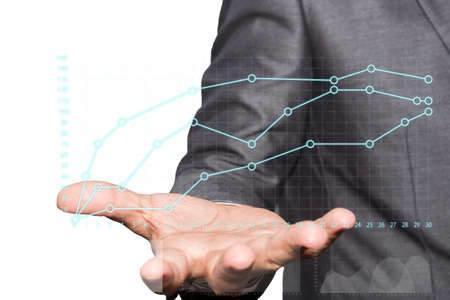 Businessman holding with growing graph symbols in handの写真素材