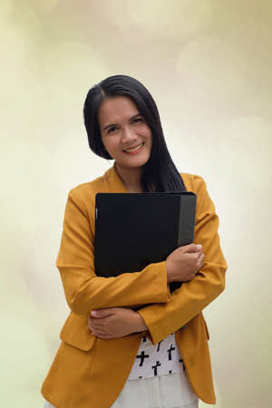 business people. Young Asian women holding a file.のeditorial素材