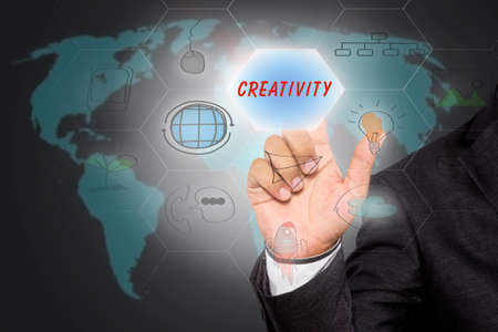 pressing touch screen interface and select "CREATIVITY", business concept , business ideaのeditorial素材