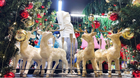 Christmas decoration with reindeer and christmas tree in shopping mallの写真素材