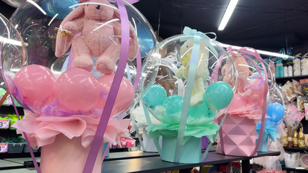 Colorful balloons and teddy bear in the shop, closeupの写真素材