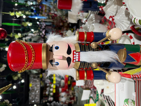 Nutcracker soldier drummer standing as a traditional christmas holiday decoration with red hat, blue...