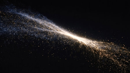Glittering particles stream across a dark background, forming an abstract cosmic dust cloud with vibrant golden and shimmering blue hues, symbolizing energy, magic, and celestial movementの写真素材